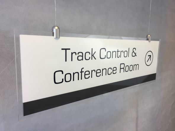 hanging directional sign