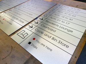 stainless steel apartment block wayfinding signage