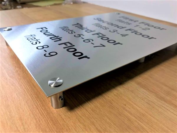 floor-level-directory-stainless-steel-etched-sign-with-black-lettering-and-standoff-fixings